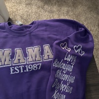 a purple sweatshirt with the word mama on it